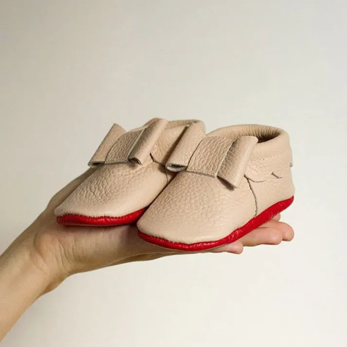 Bow moccasins with red bottom